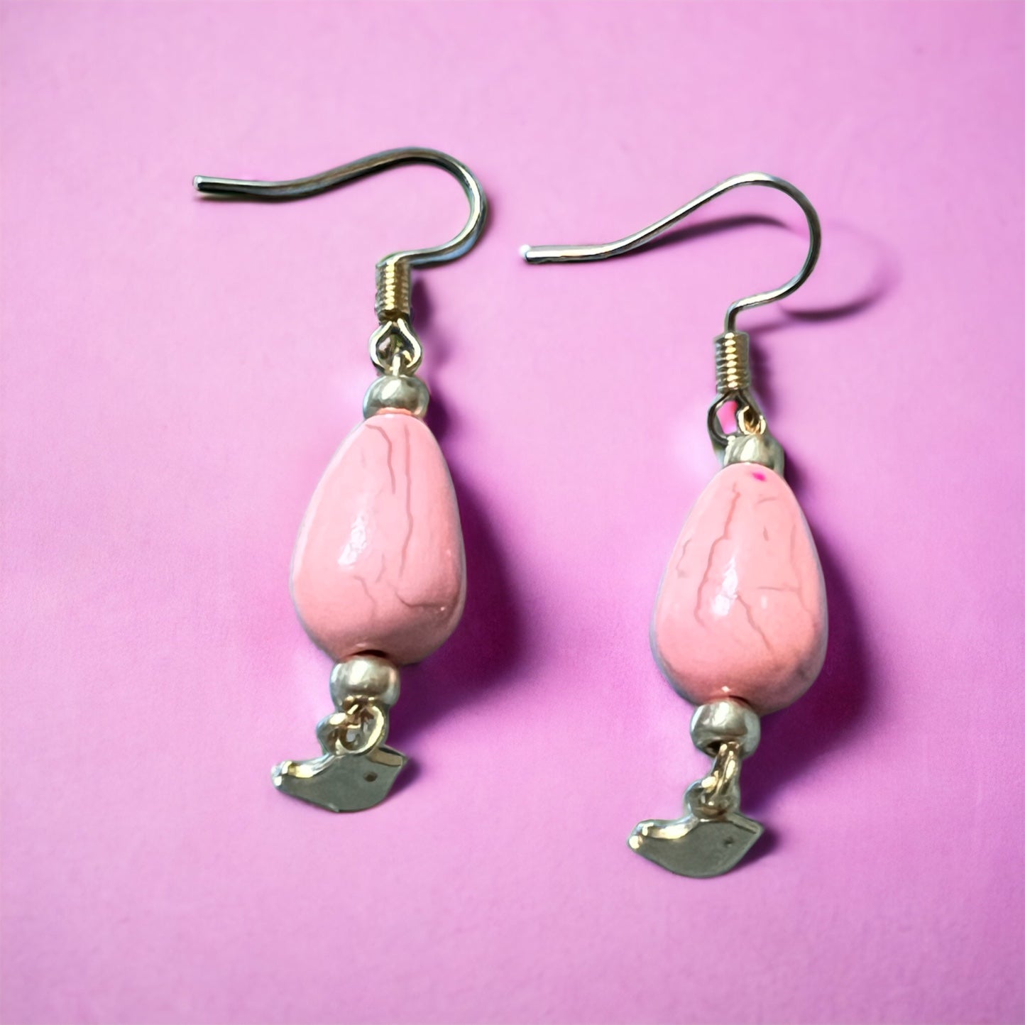 Pink gold bird pendant earrings