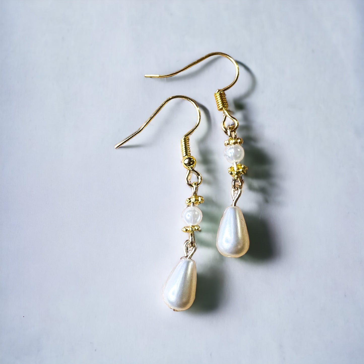Gold pearl earrings