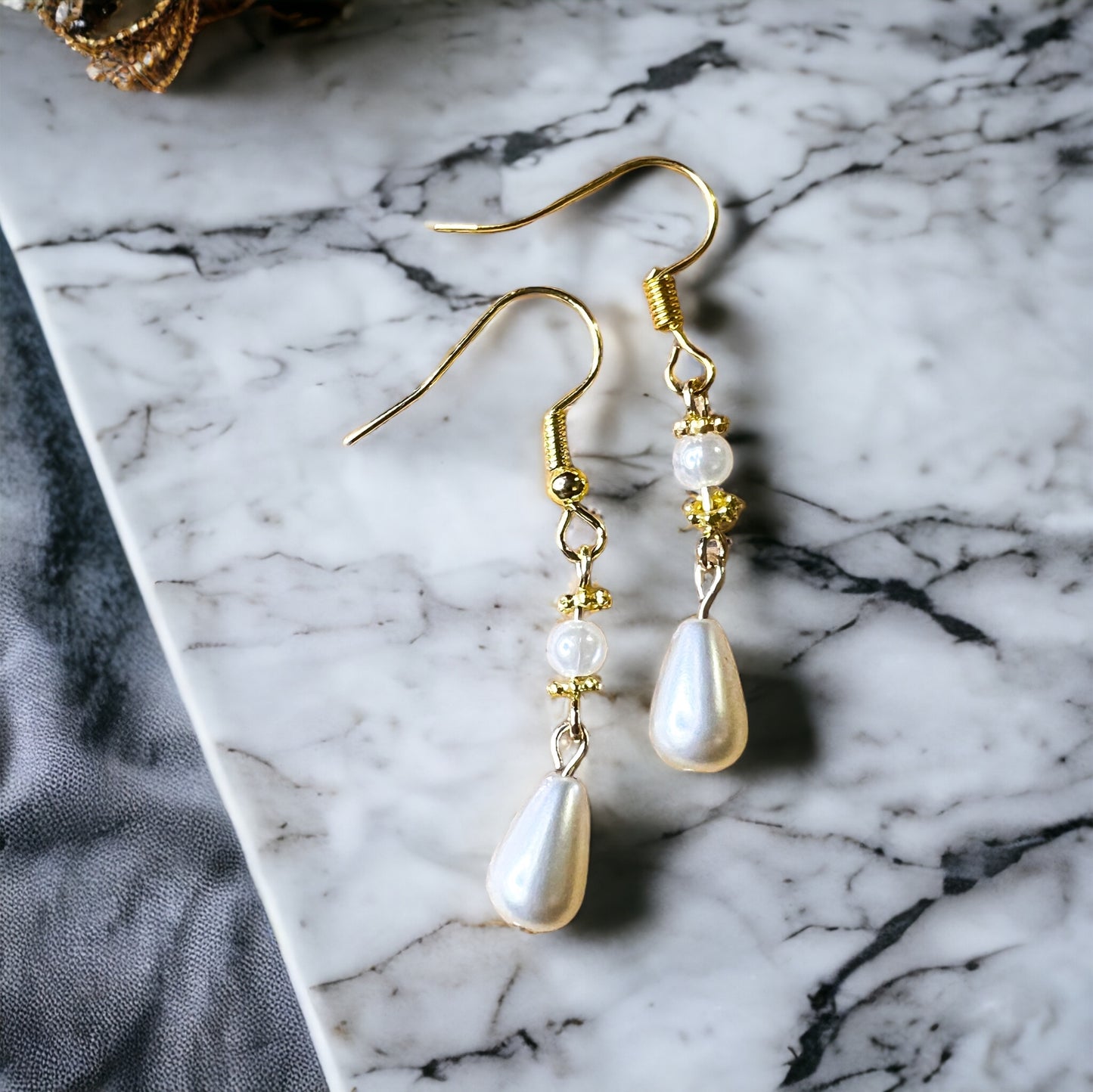 Gold pearl earrings
