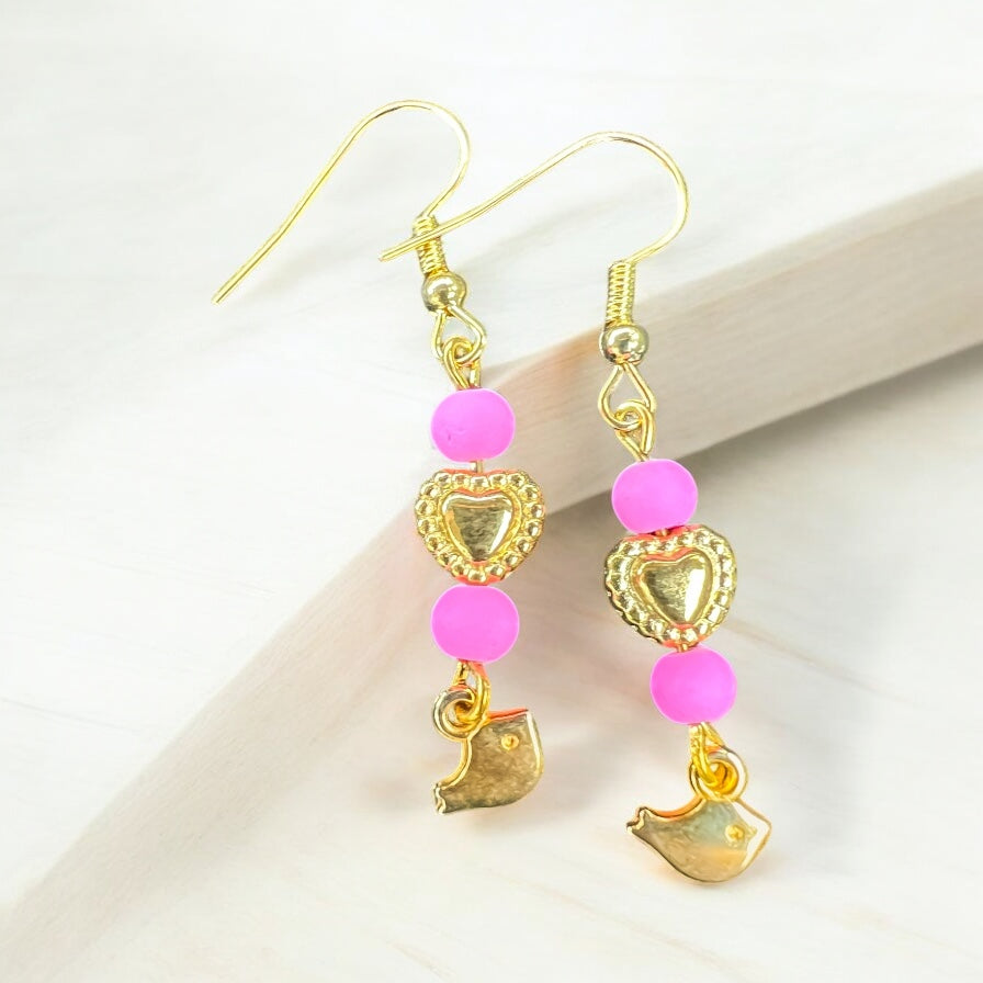 Roze gouden oorbellen met vogel hangers