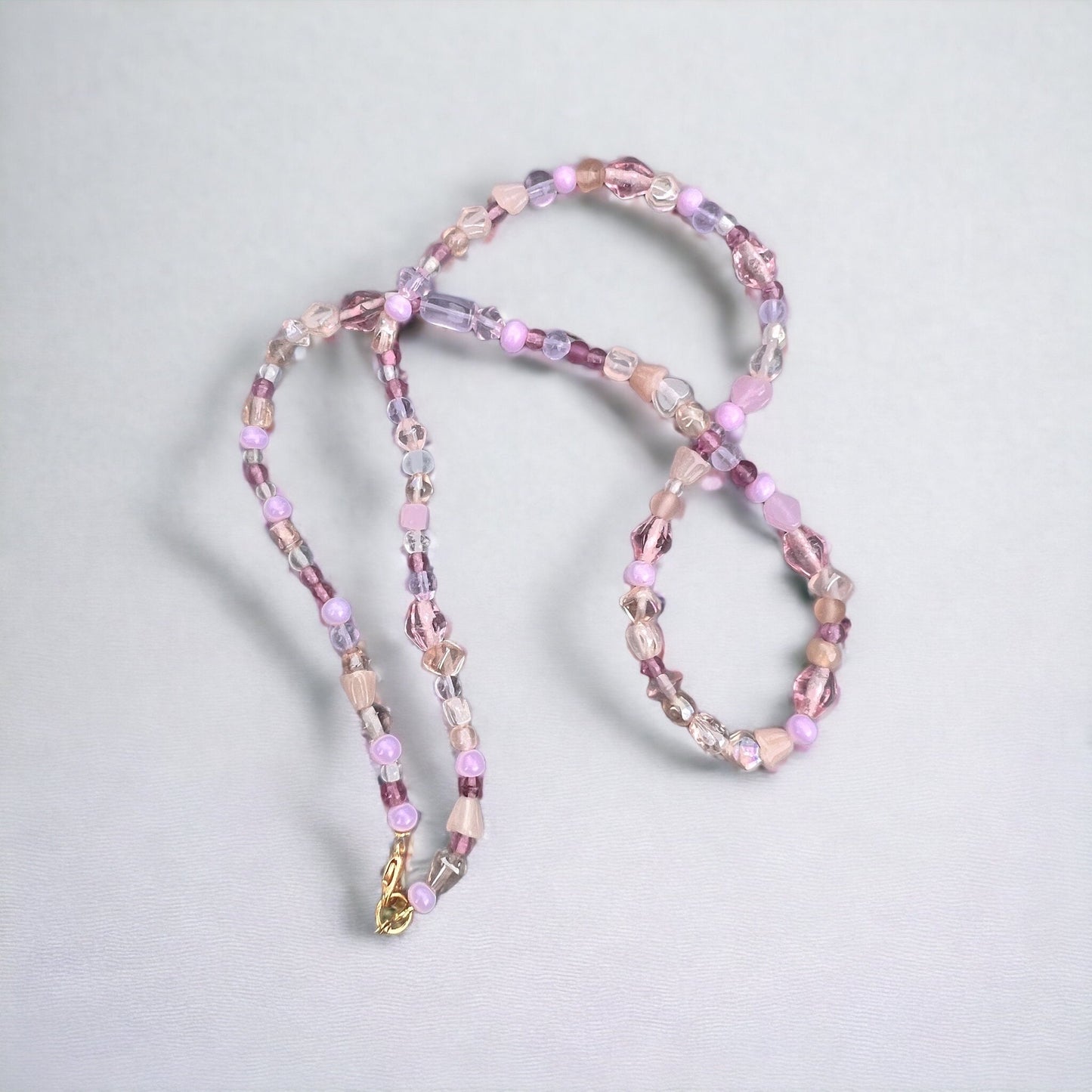 Purple, white, pink, gold beaded necklace