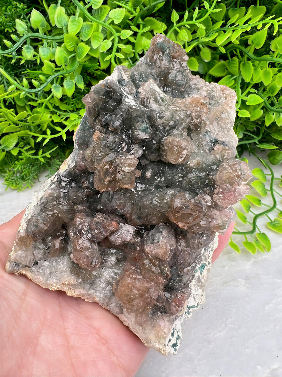 a person holding a piece of rock in their hand