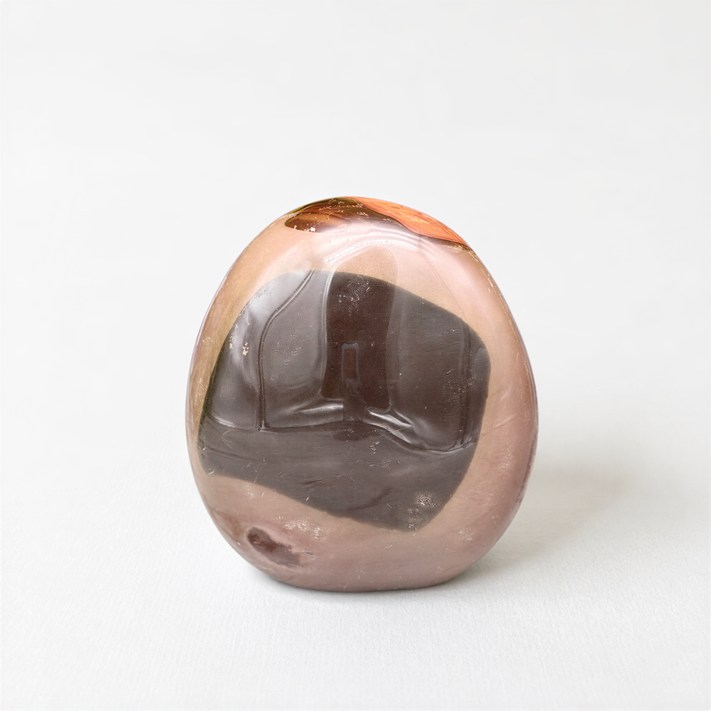 a single, round, brown and black stone or gemstone, which appears to be a natural stone or gemstone.