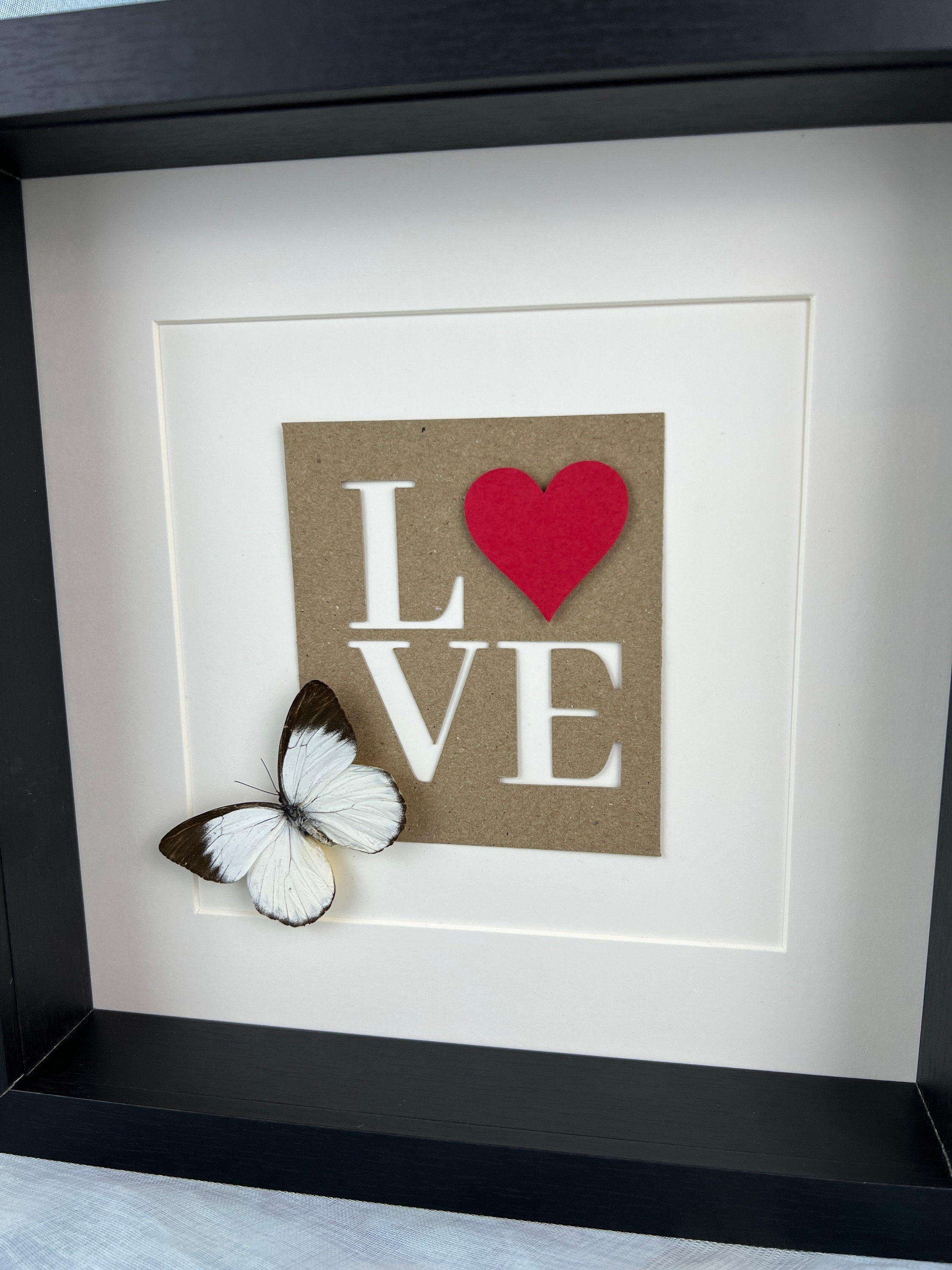 Appias und Liebesbriefe im Rahmen