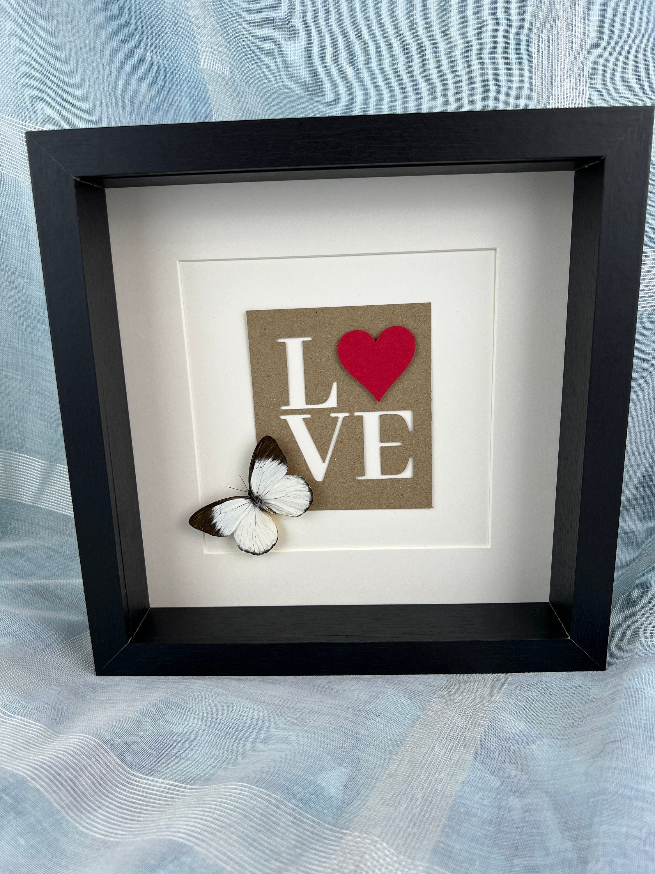 Appias und Liebesbriefe im Rahmen