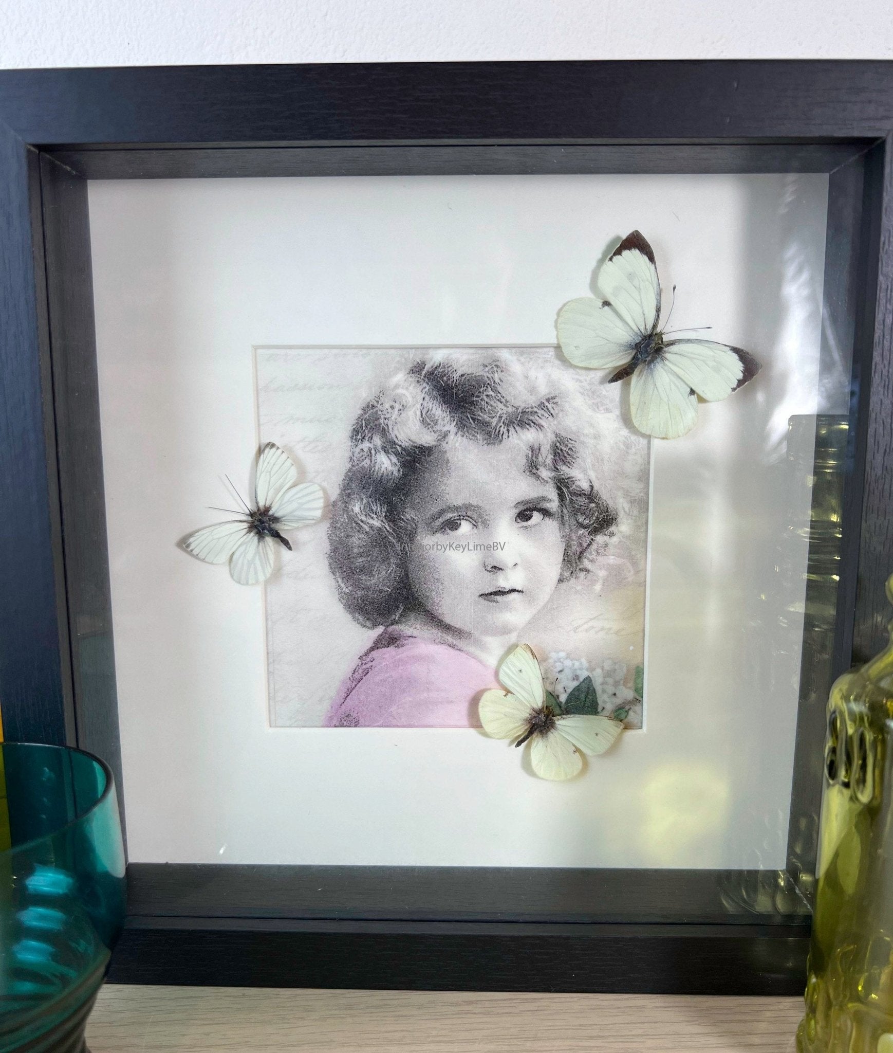 White butterflies on a vintage print in a frame by KEY LIME STORE