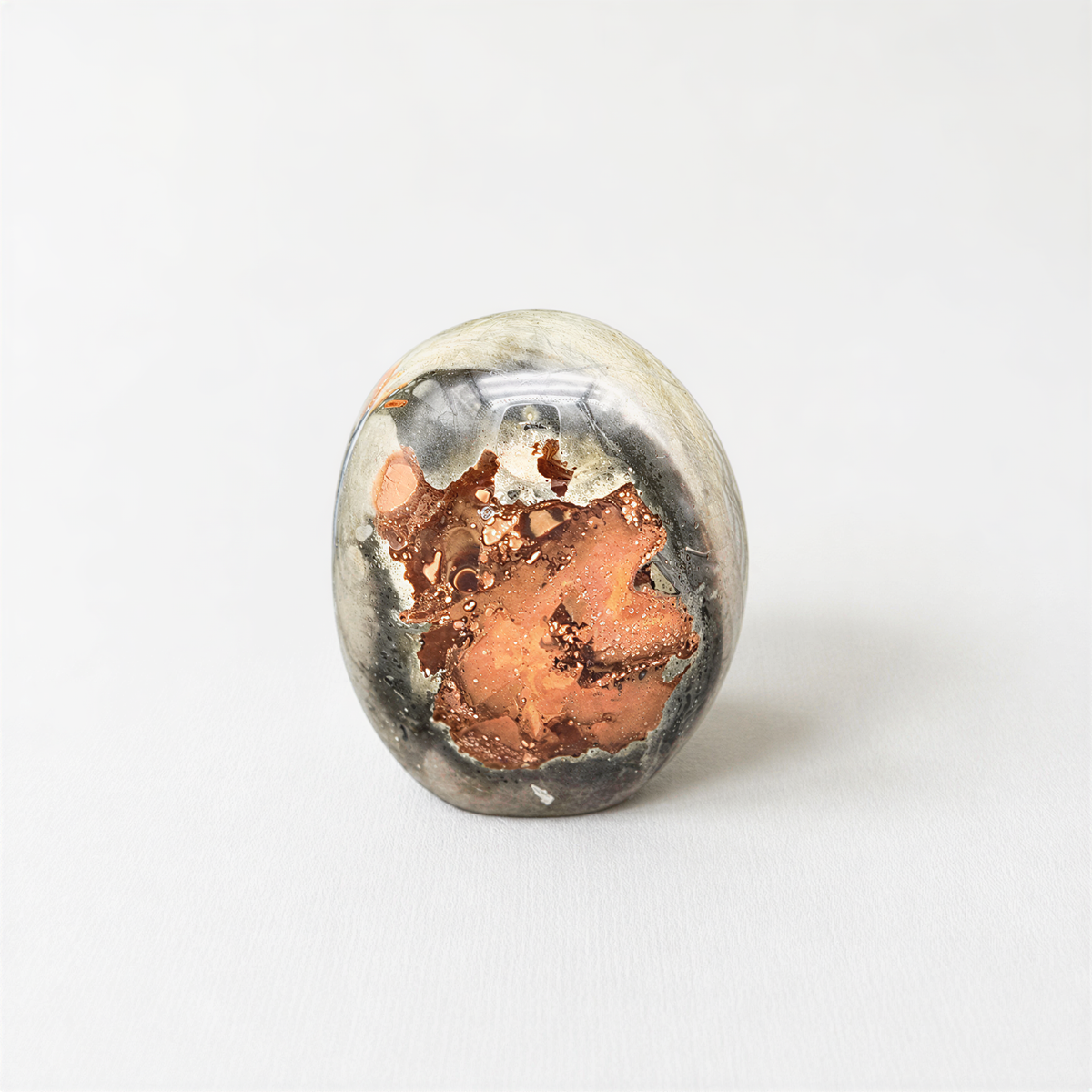 a round, metallic object with a unique, textured surface.