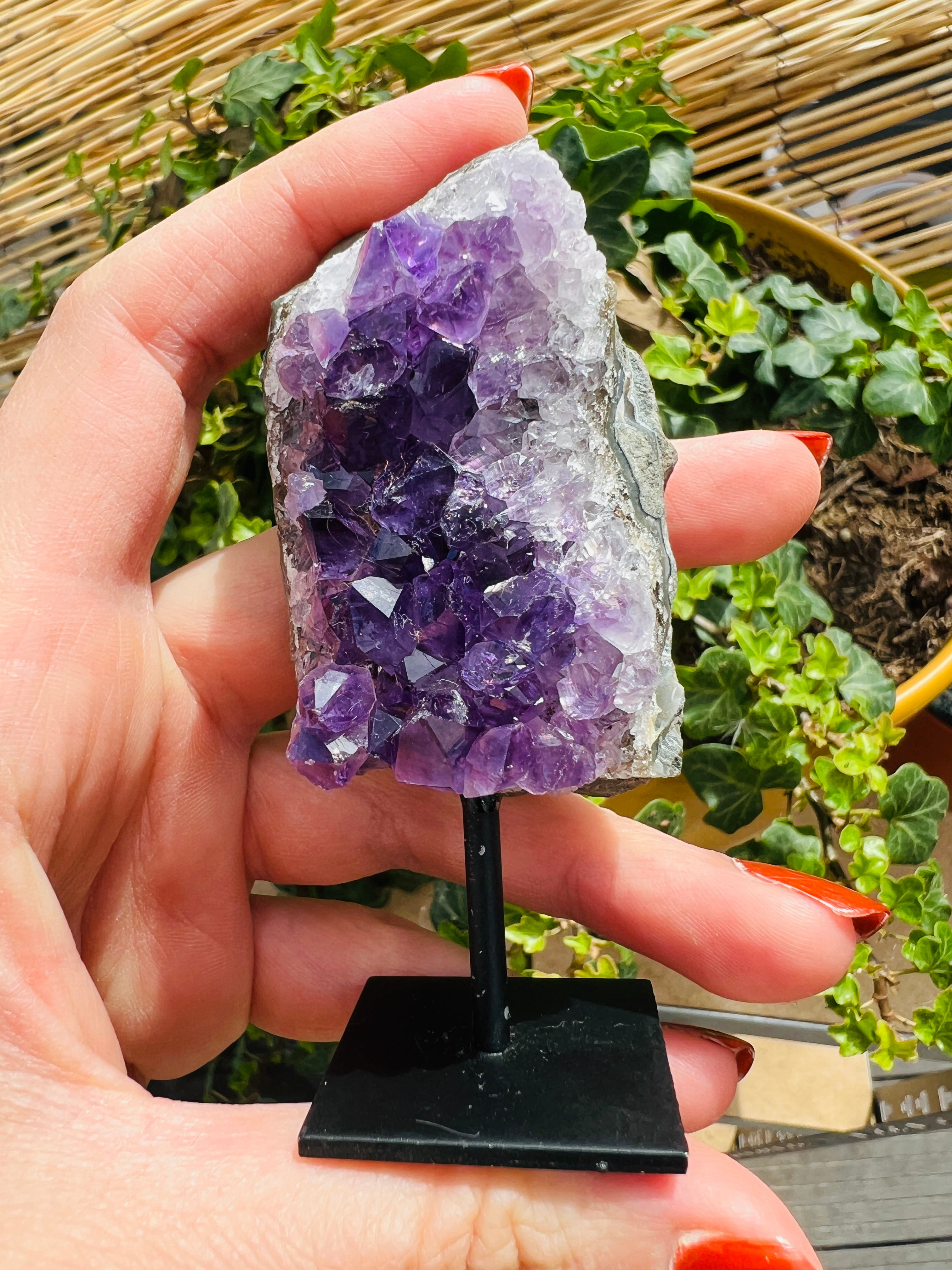 Amethyst crystal cluster on stand