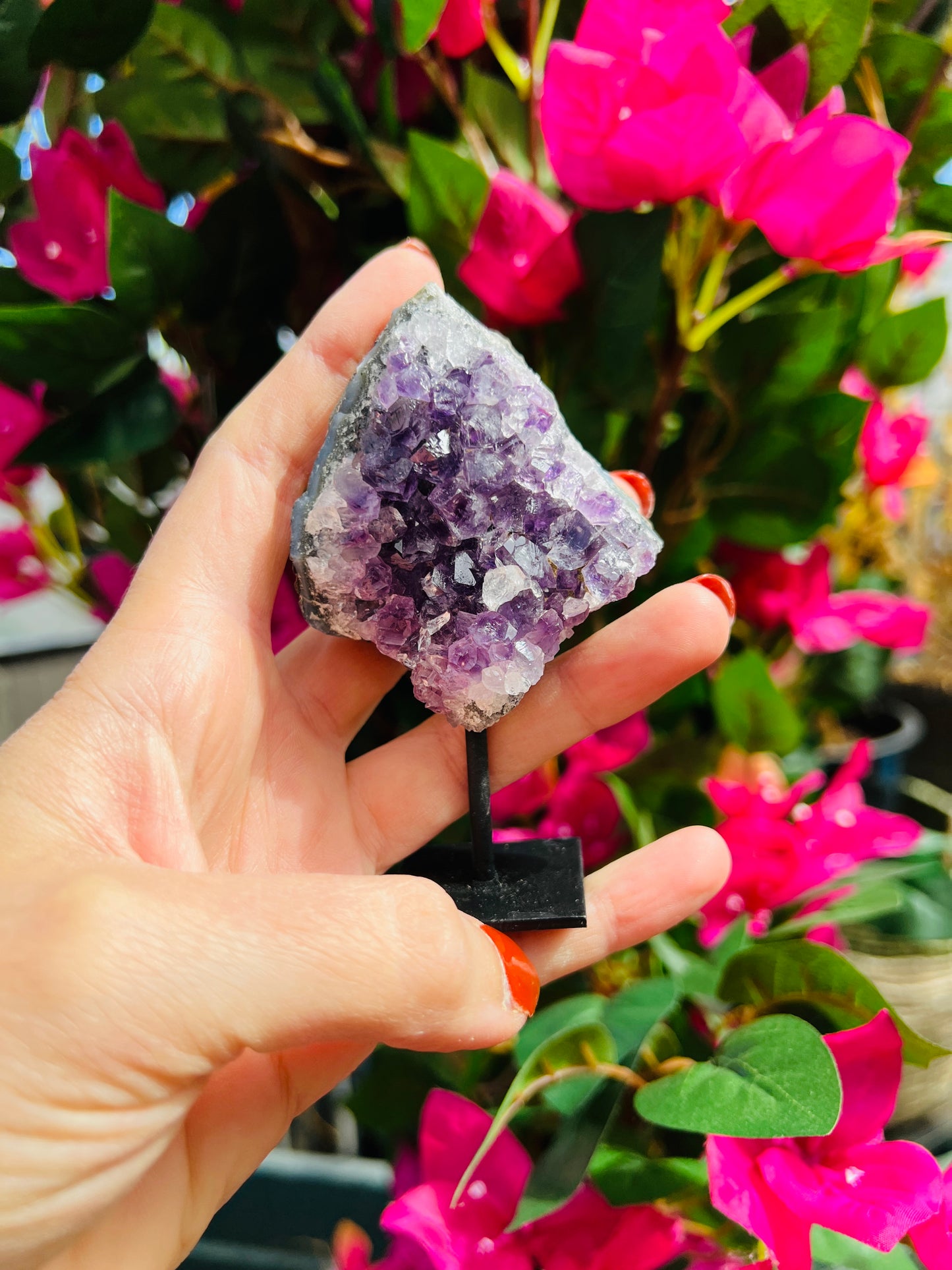 Amethyst crystal cluster on stand