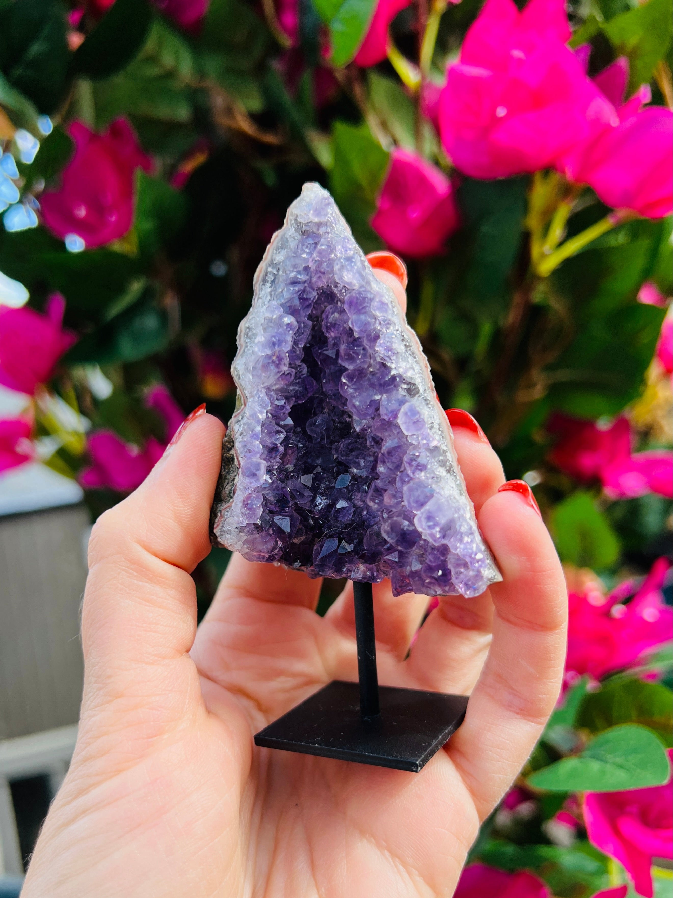 Amethyst crystal cluster on stand
