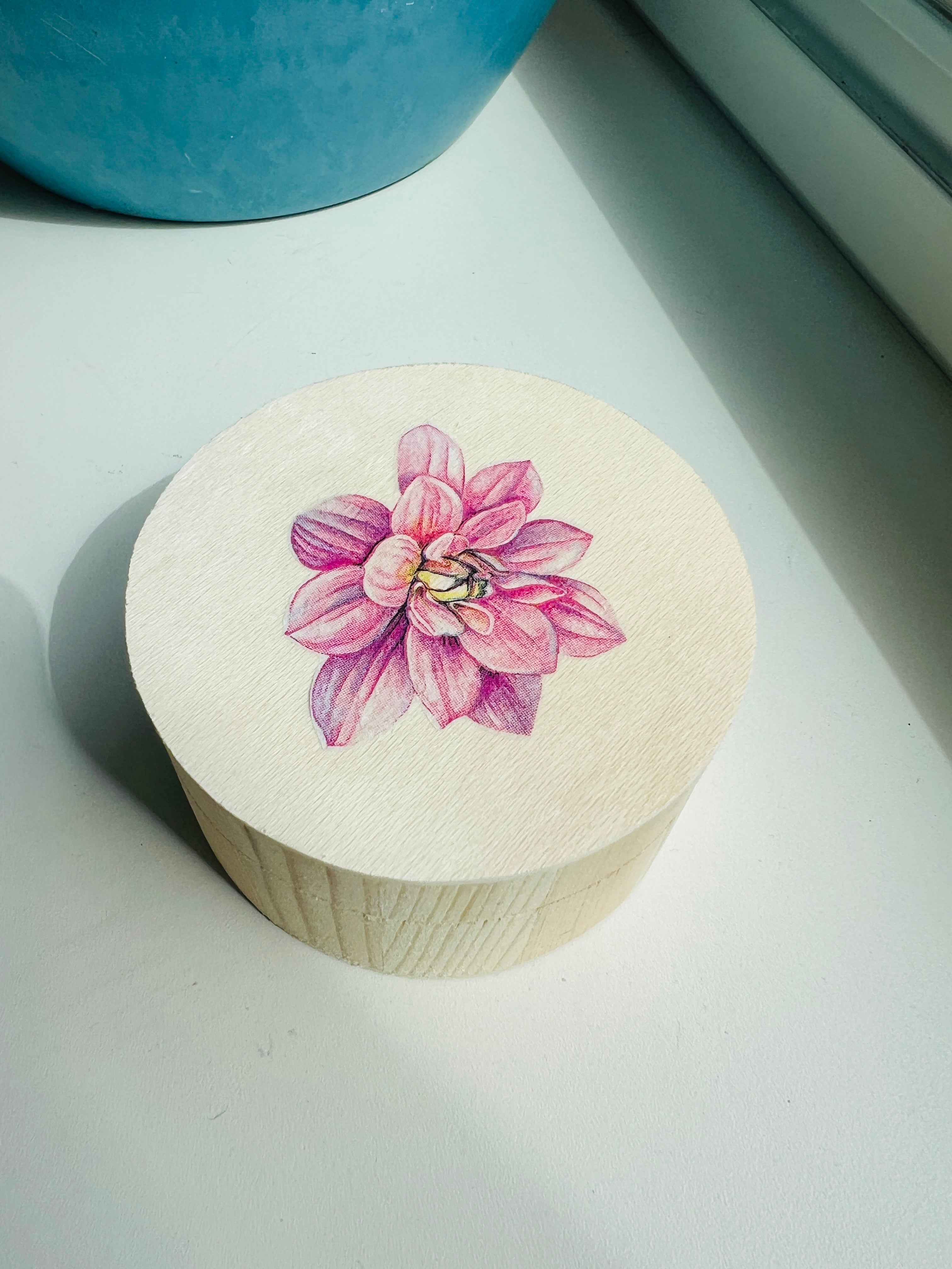 Wooden box with a pink flower