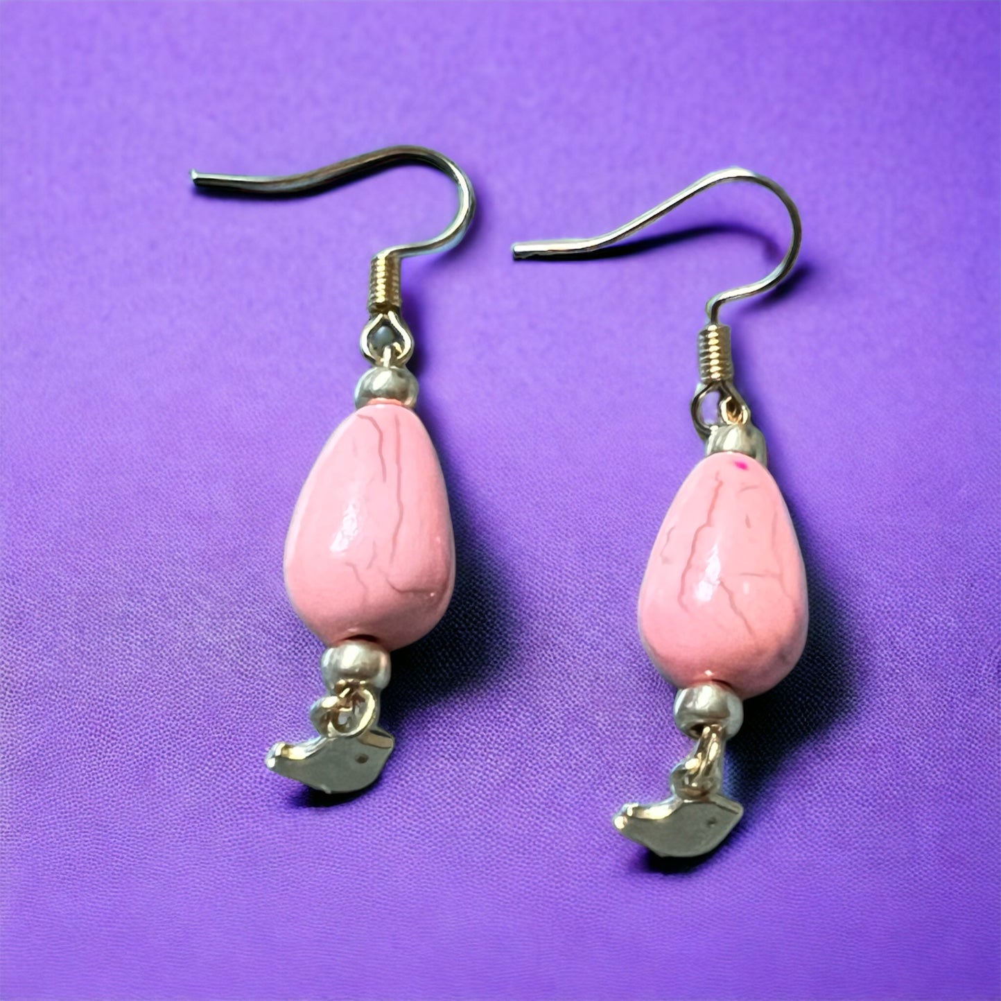 Pink gold bird pendant earrings