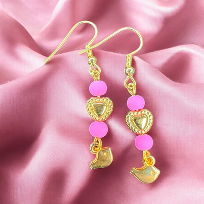 Roze gouden oorbellen met vogel hangers