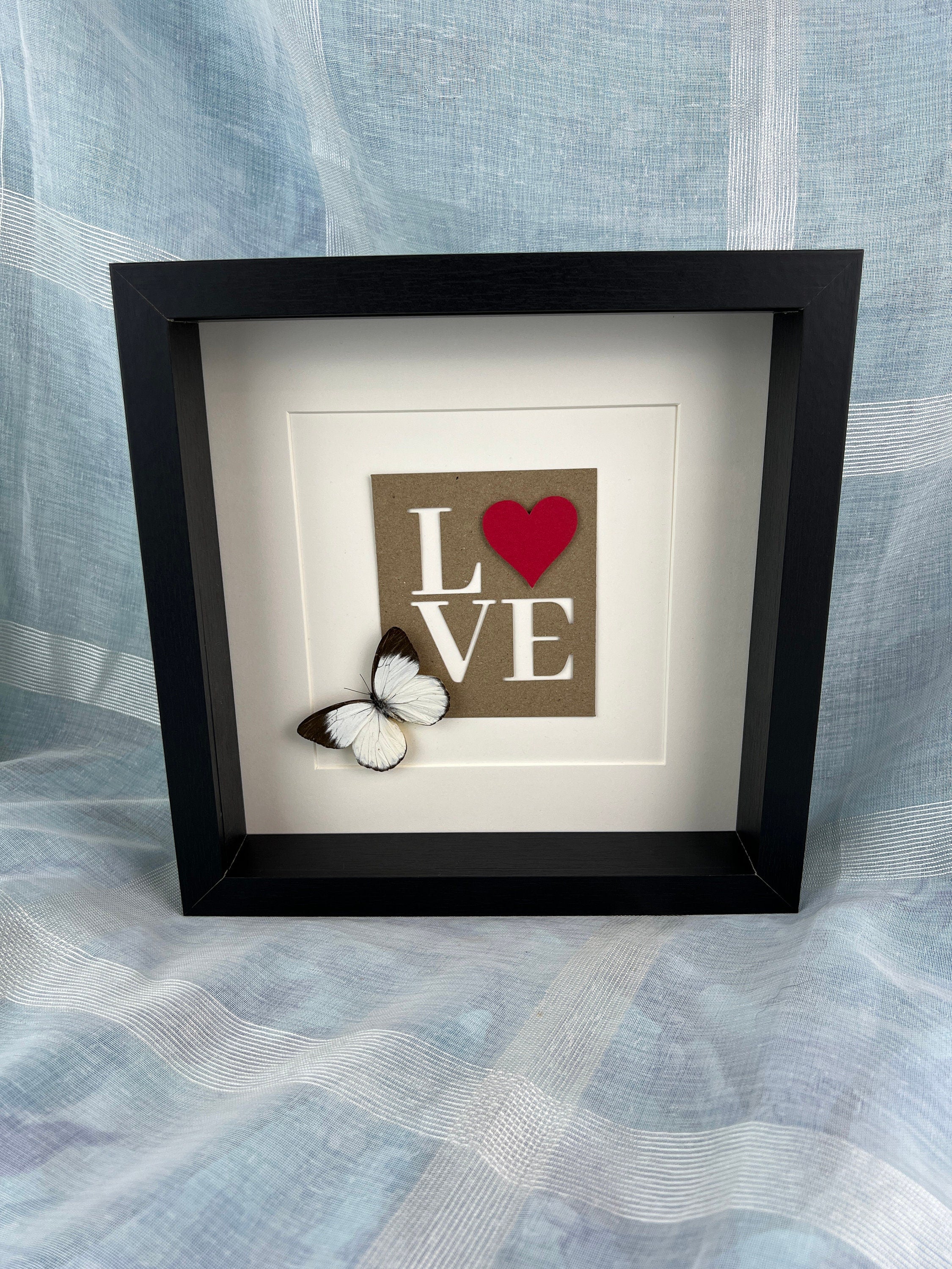 Appias und Liebesbriefe im Rahmen