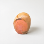a single, abstract, and colorful object, which appears to be a piece of art or a sculpture.