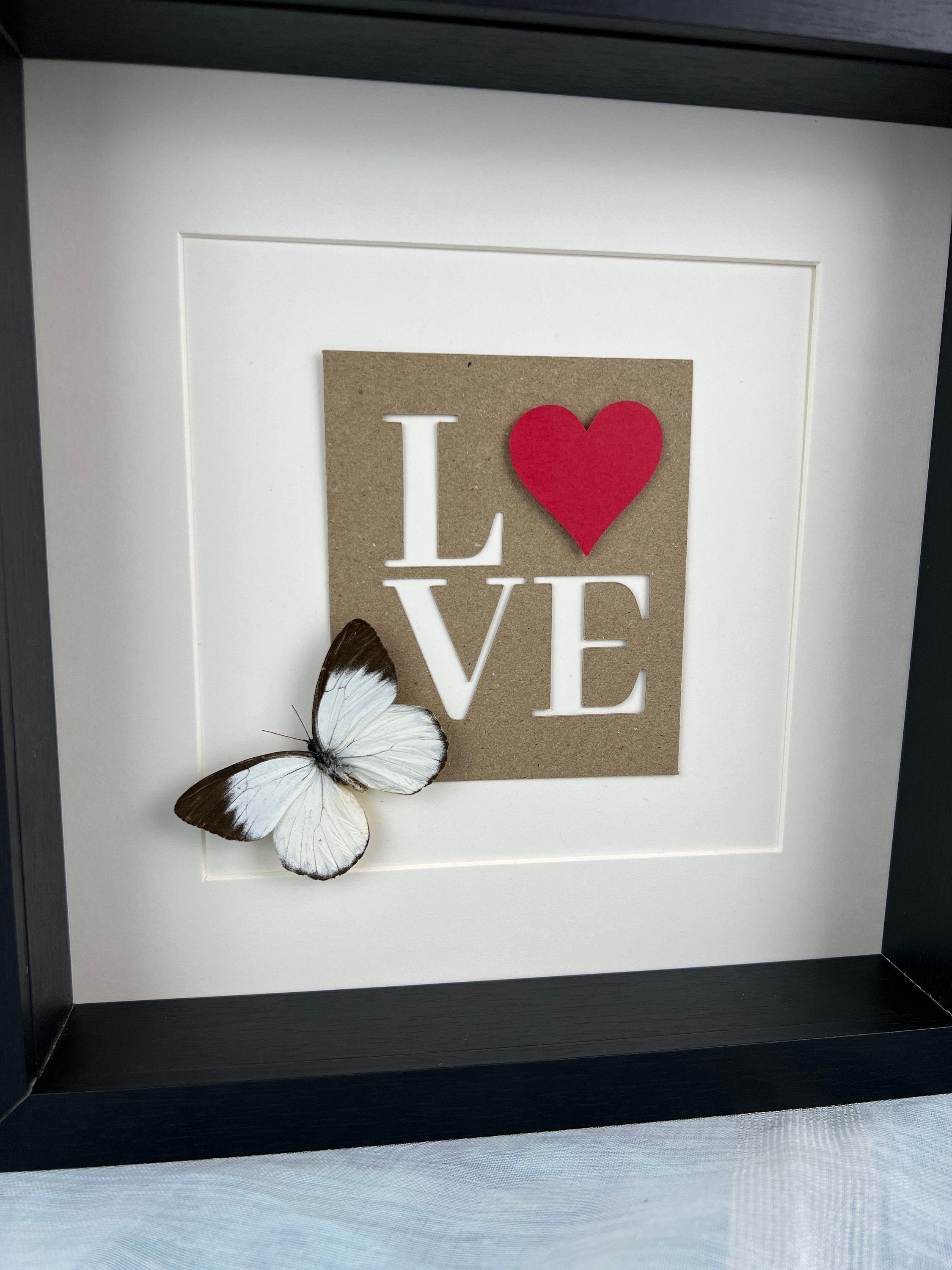 Appias und Liebesbriefe im Rahmen