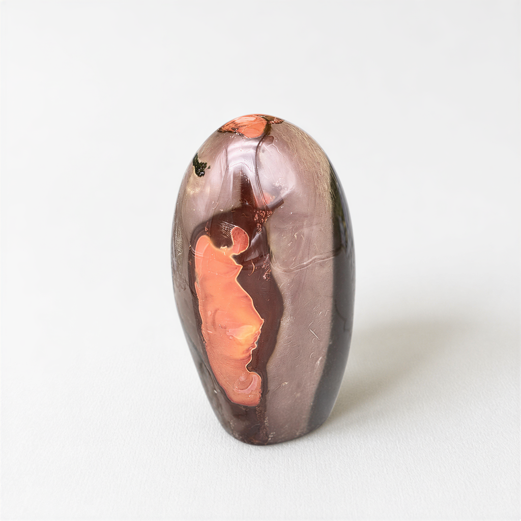 a single, unique, and colorful rock or gemstone, which appears to be a piece of art or a decorative item.