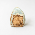 a single, unique rock with a striking pattern of light and dark colors, including shades of blue, brown, and orange.
